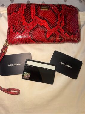 Preloved Dolce & Gabbana Red and Black Snakeskin Zip-Around wallet.